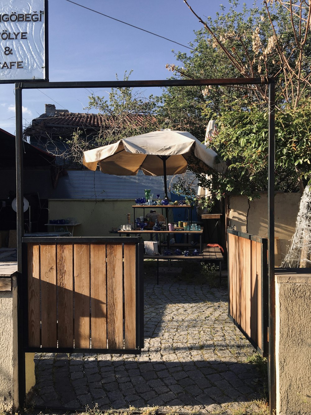 an outdoor bar with an umbrella over it