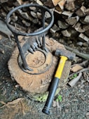 a hammer and a log on the ground