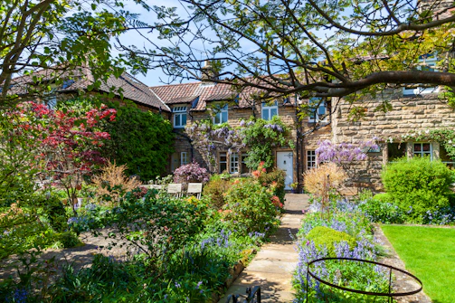 a house with a garden in front of it