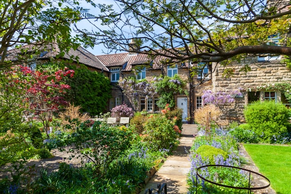 Beautifully designed UK cottage garden with colourful planting