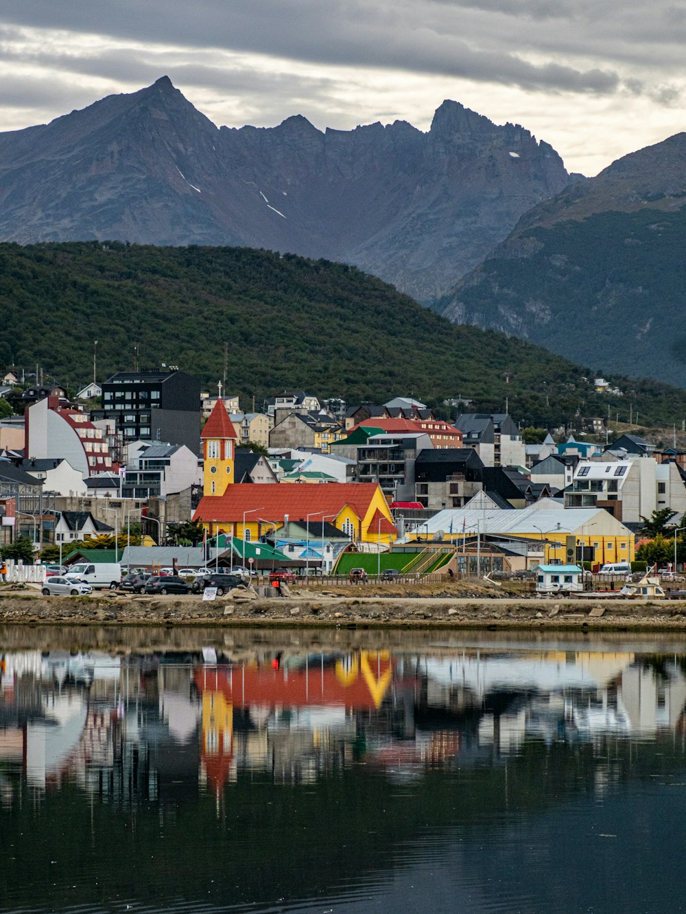 a small town with mountains in the background