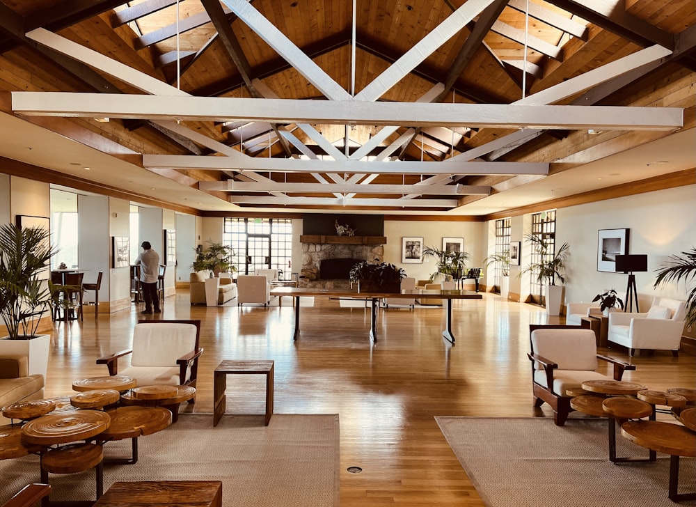 a large open living room with wooden floors