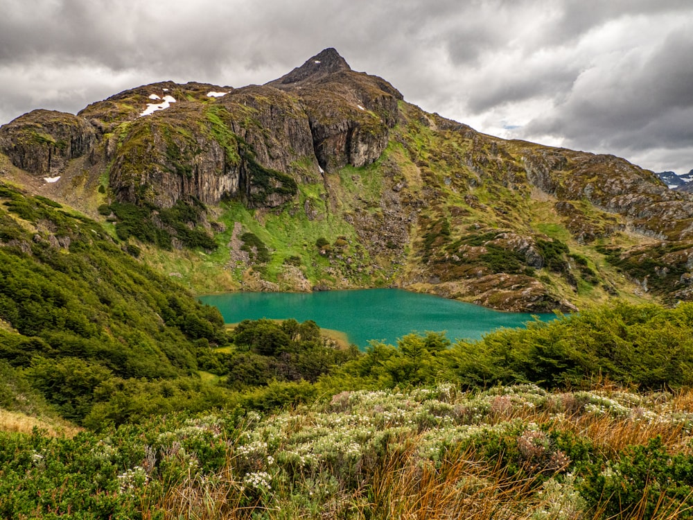 a mountain with a lake in the middle of it