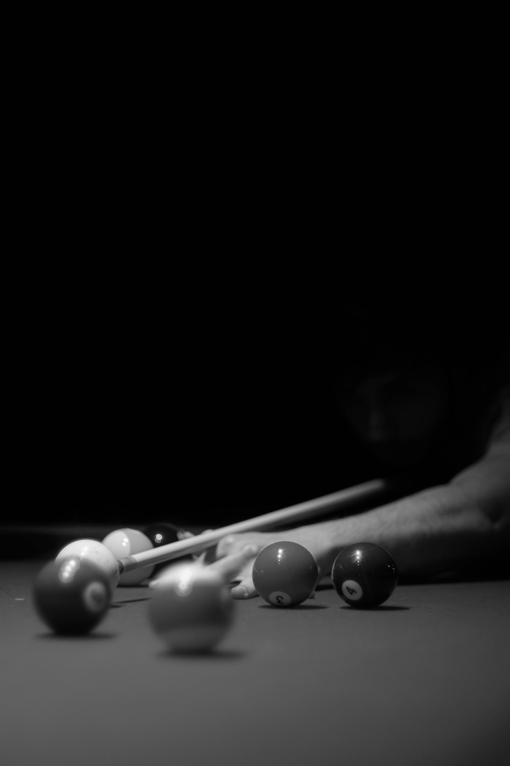 a pool table with eight balls and cues