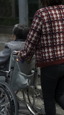 a woman pushing a child in a stroller