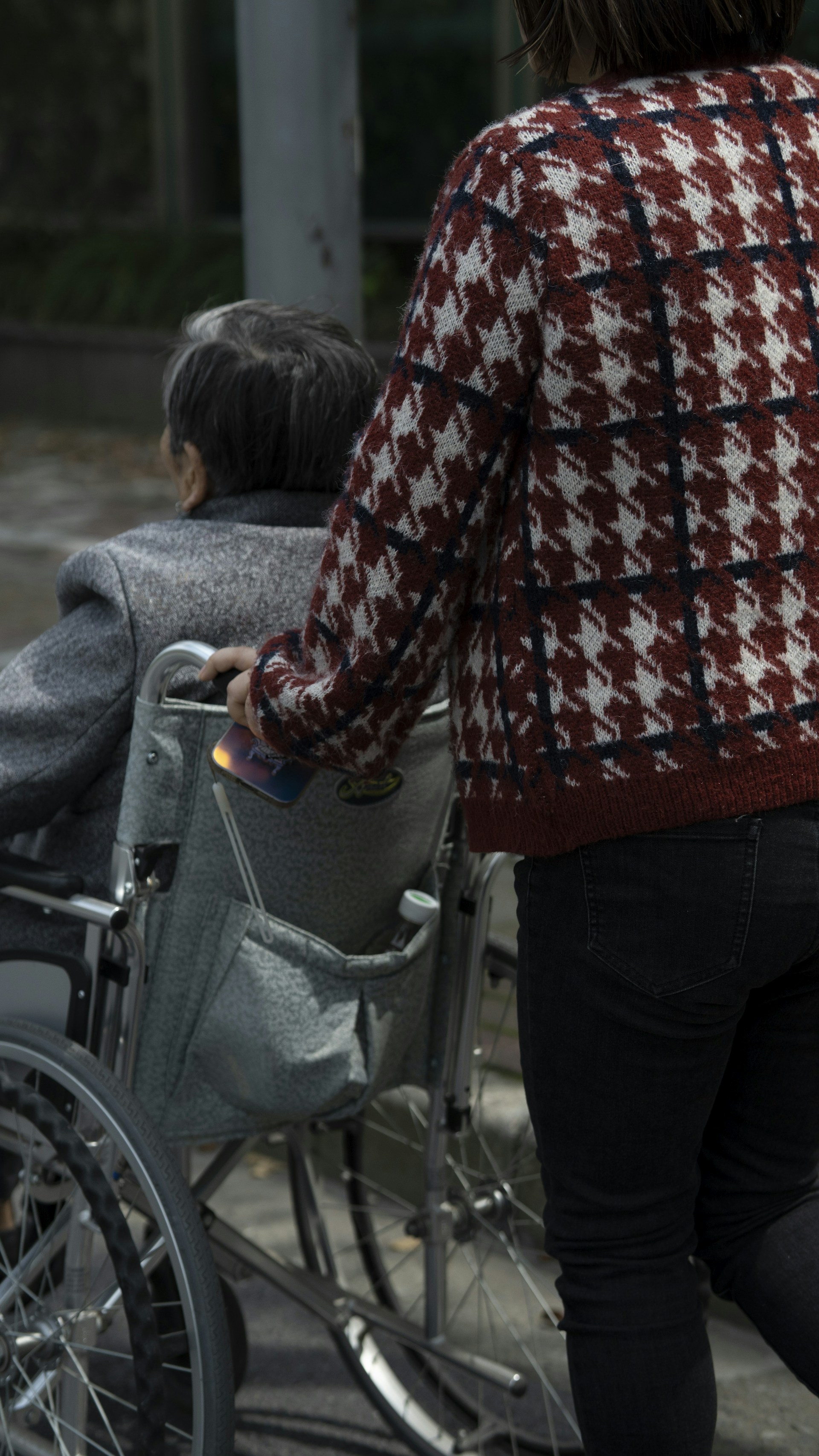 a woman pushing a child in a stroller