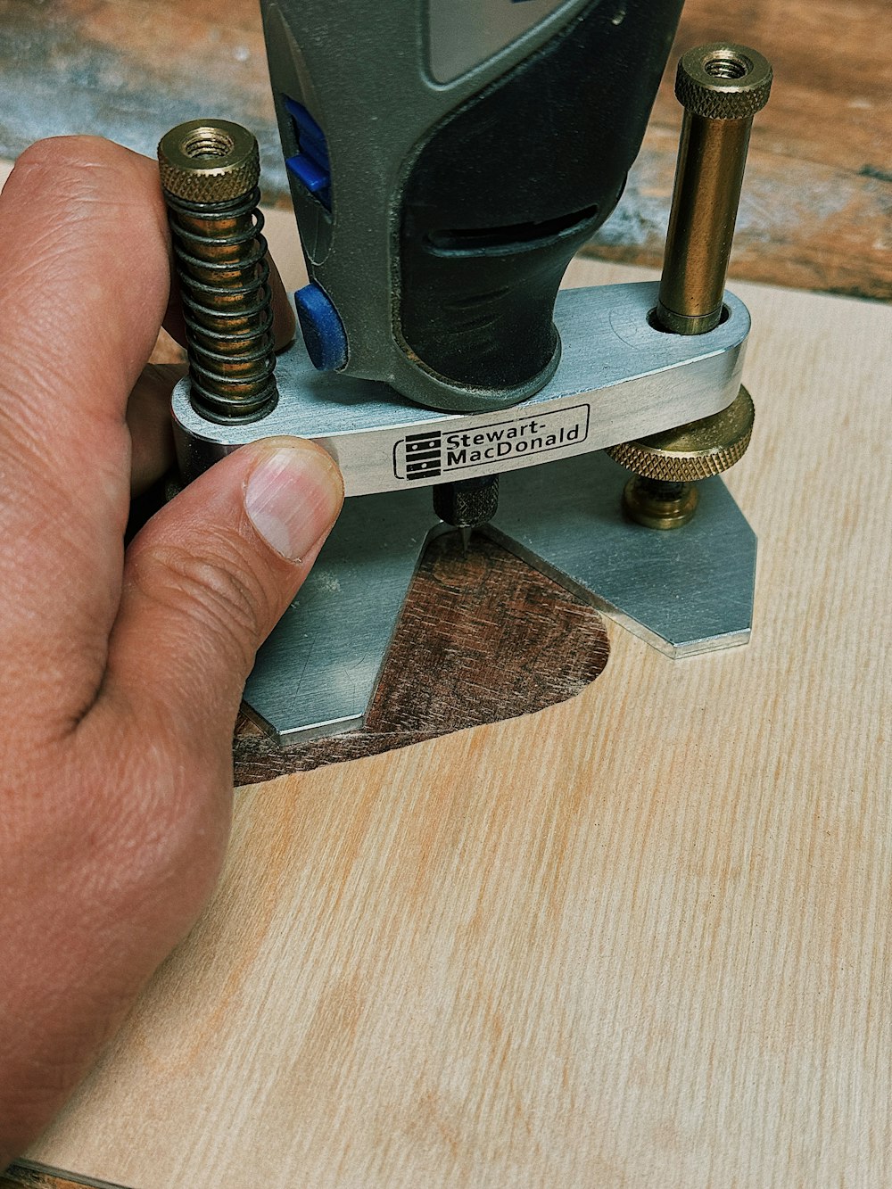 a person is working on a piece of wood