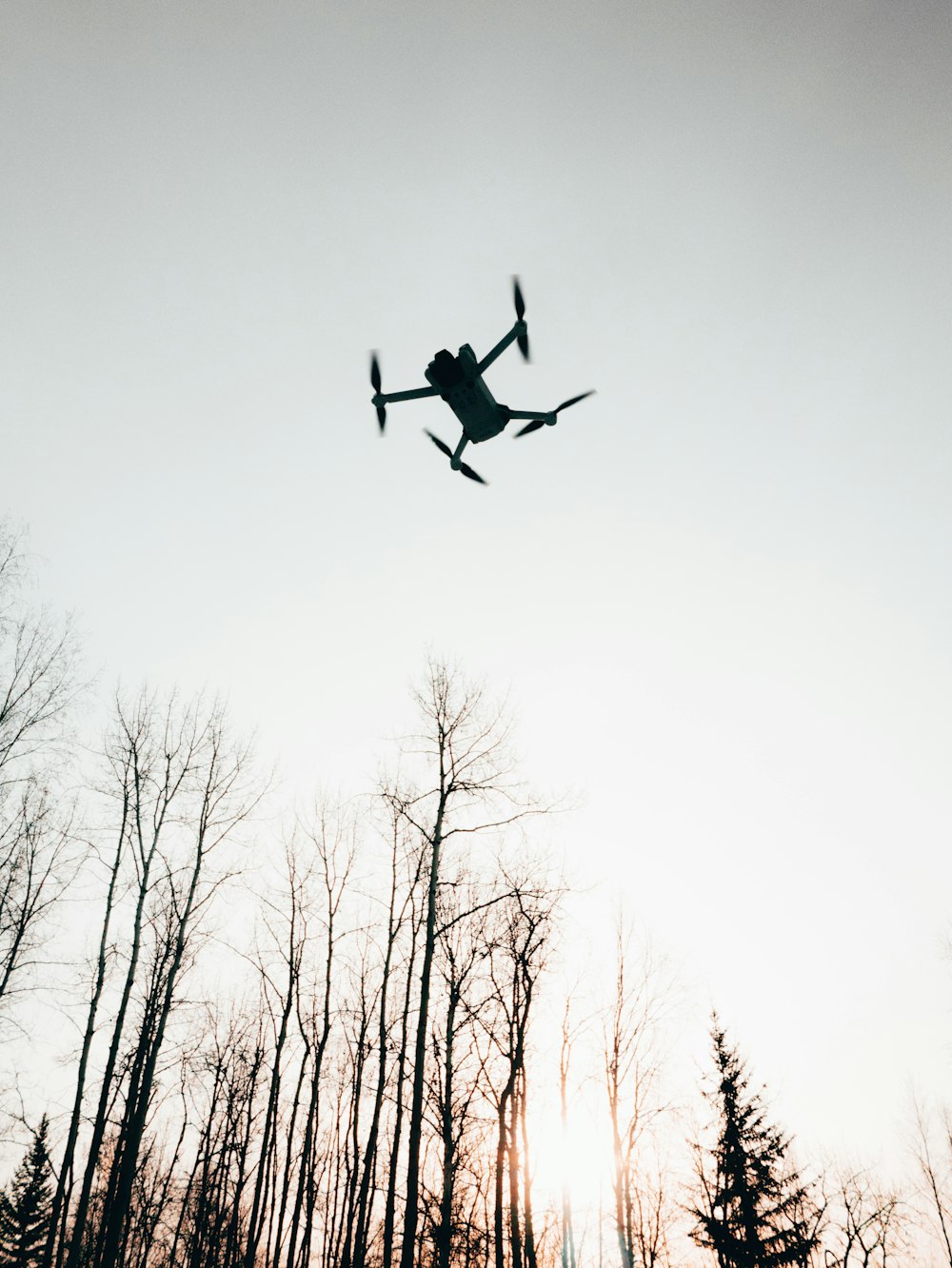 a silhouette of a man flying through the air