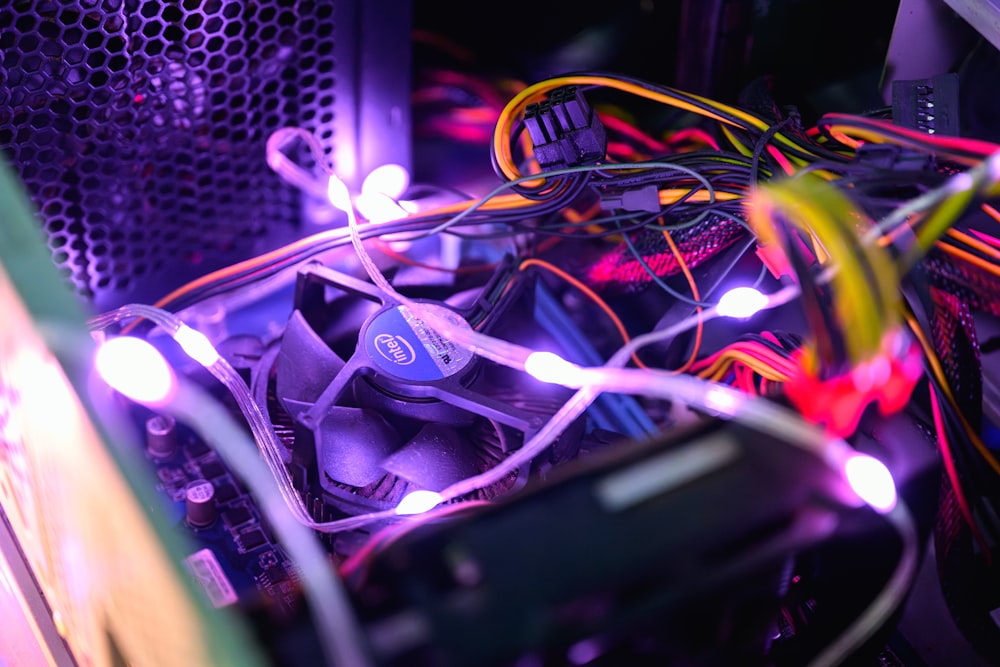 the inside of a computer case with wires and wires