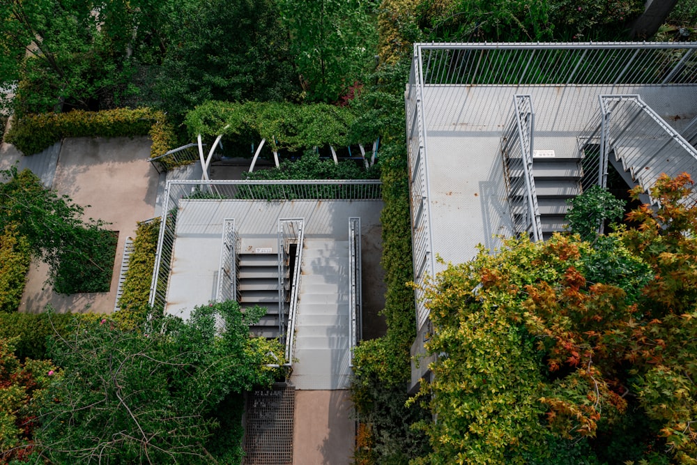 an aerial view of a building surrounded by trees