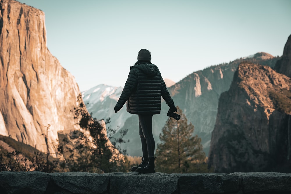 a person standing on top of a mountain