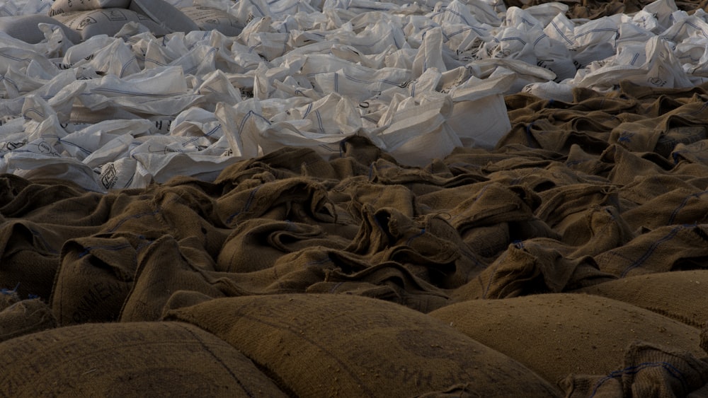 a pile of sand bags sitting on top of a beach