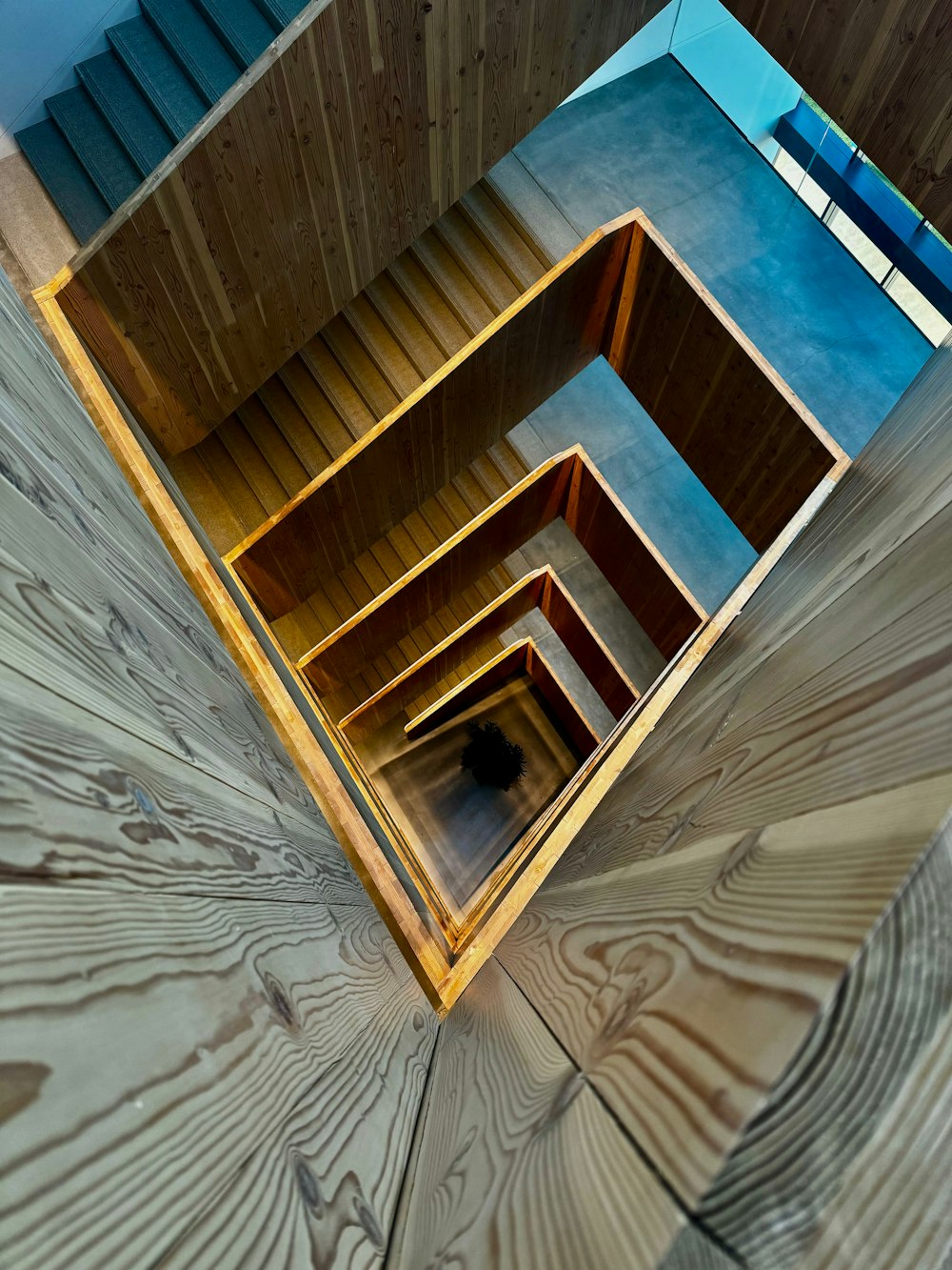 a close up of a wooden floor with a mirror