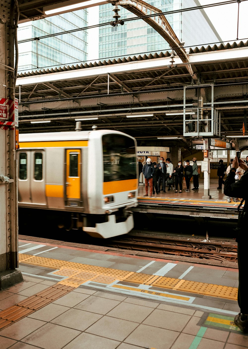 a subway train pulling into a train station