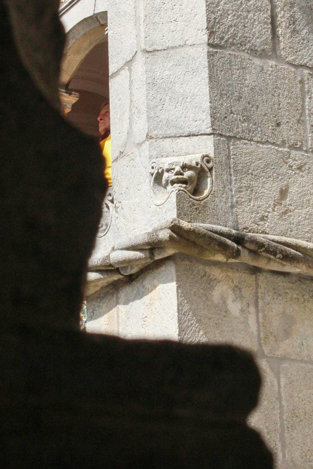 a close up of a clock on a stone building