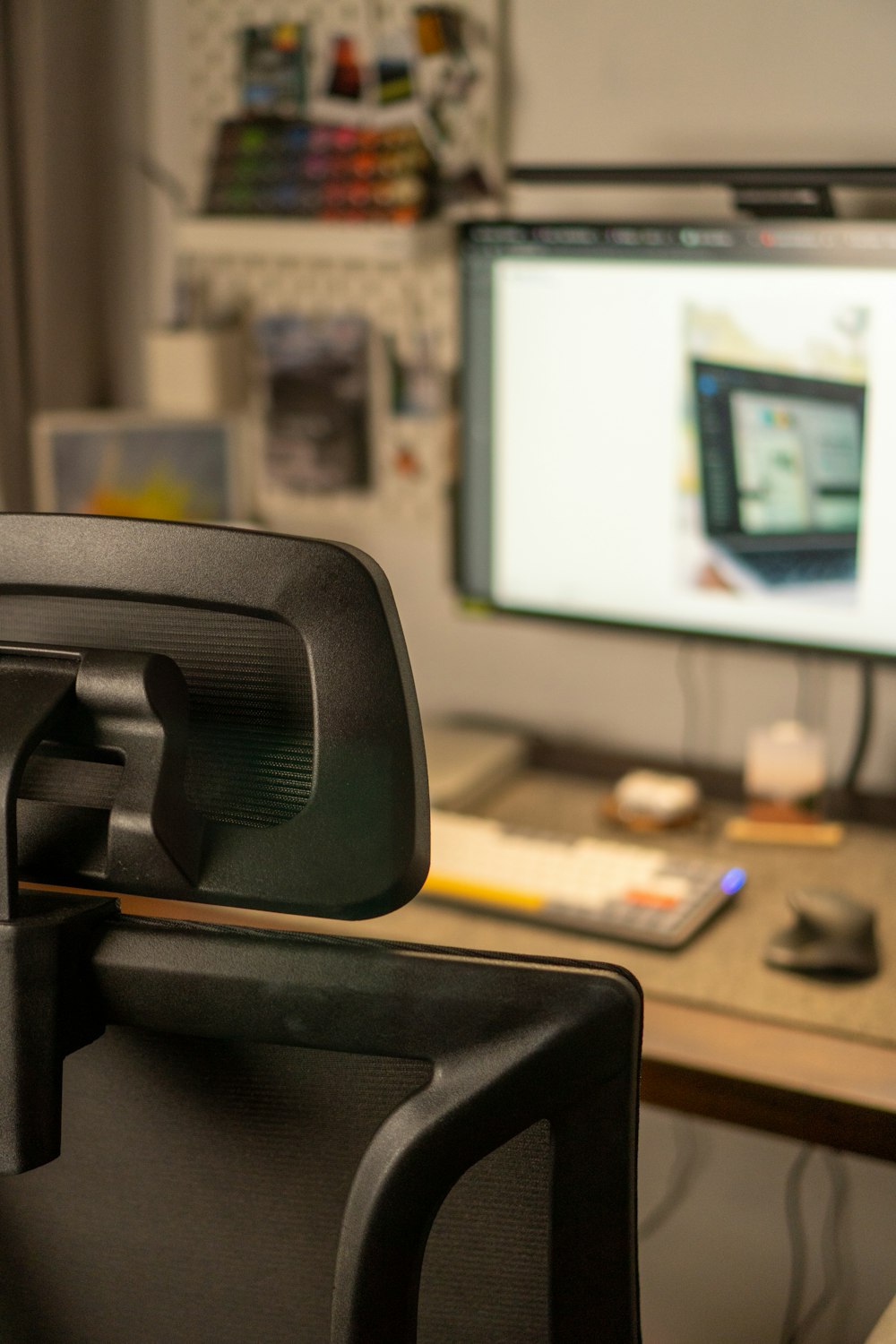 a computer desk with a monitor and keyboard