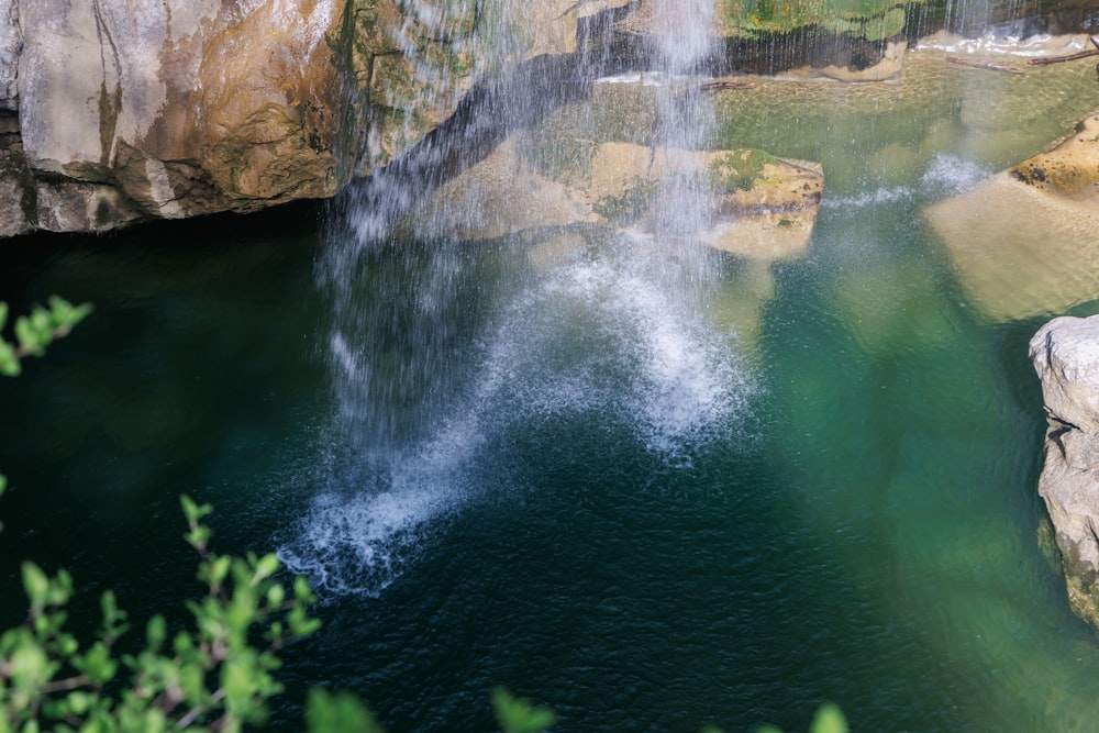 a large waterfall is coming out of the water