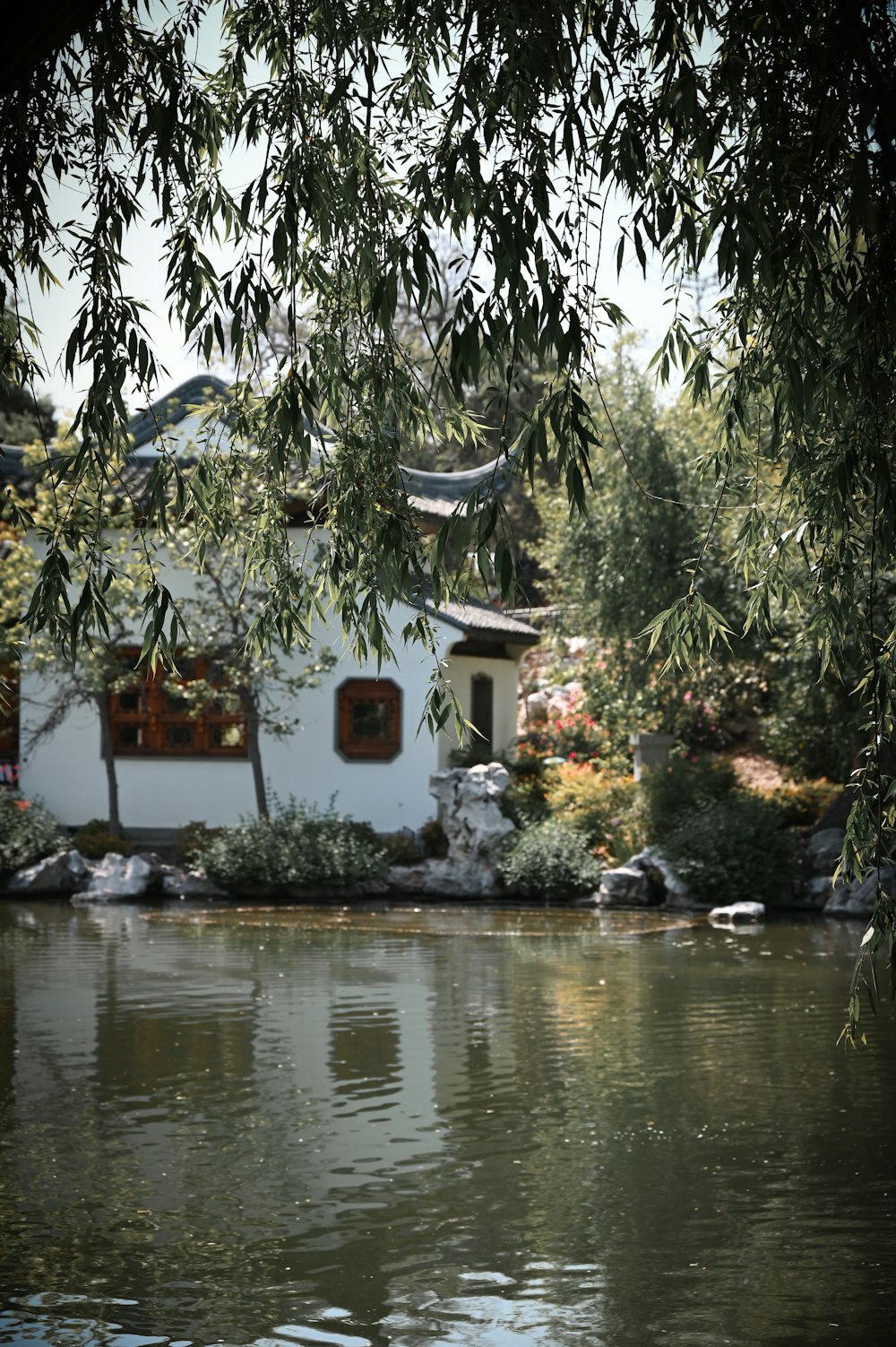 a house sitting next to a body of water