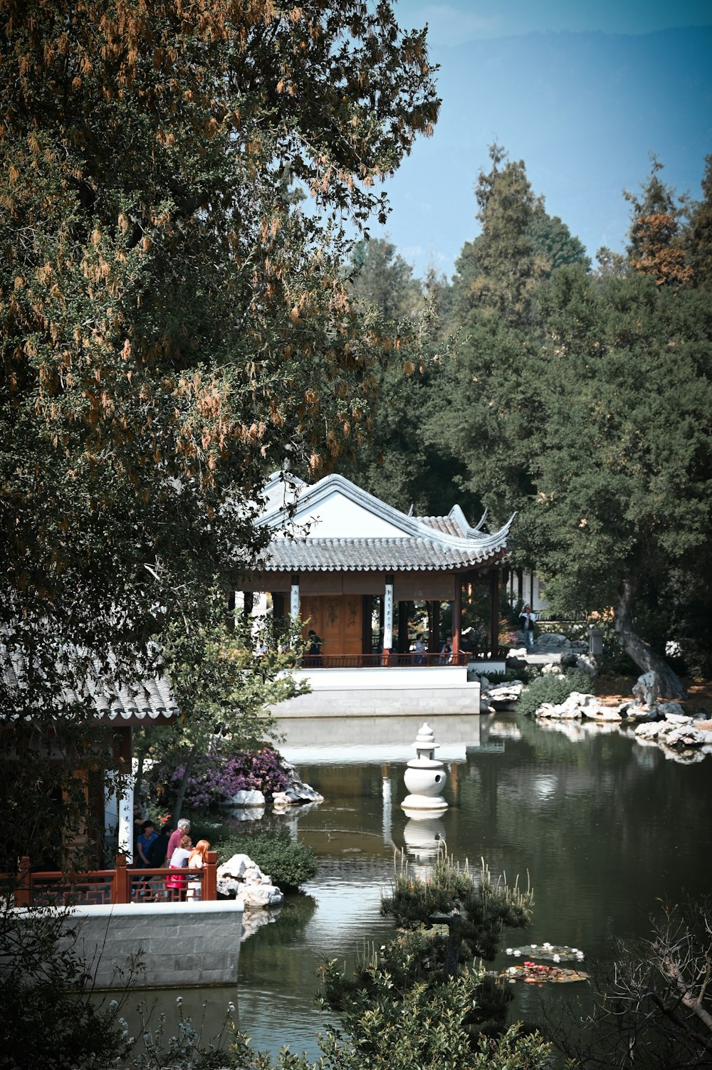 a small boat floating on top of a lake