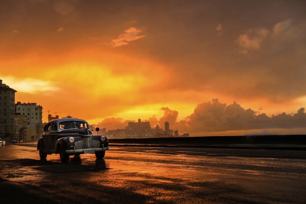 an old truck is parked on the side of the road