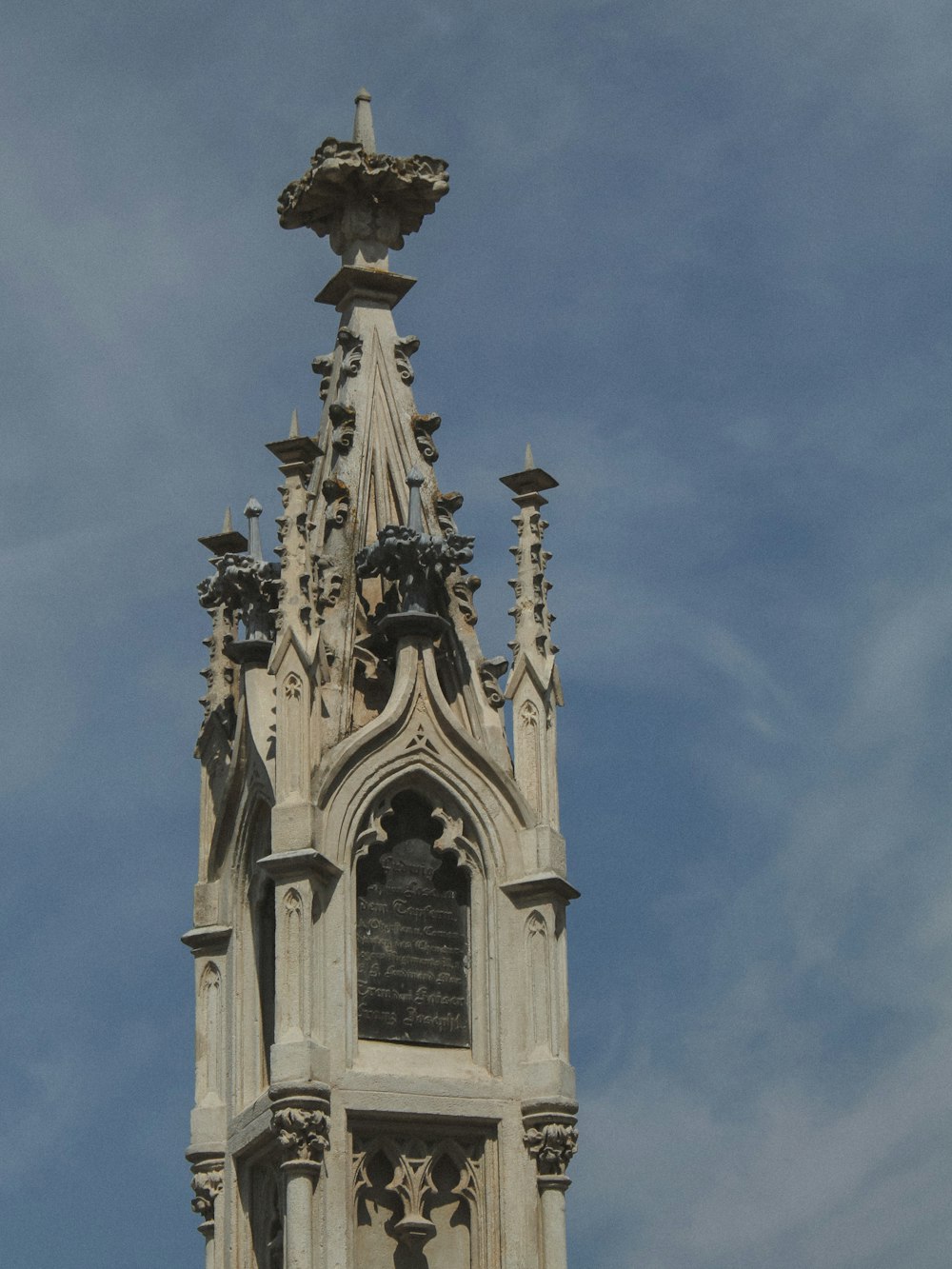 a tall tower with a clock on the top of it