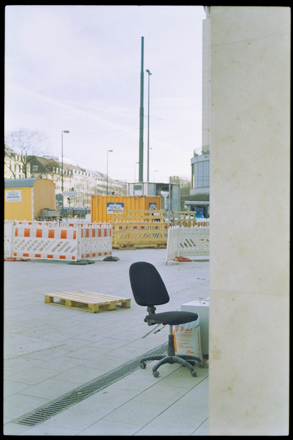 an office chair sitting on the side of a building