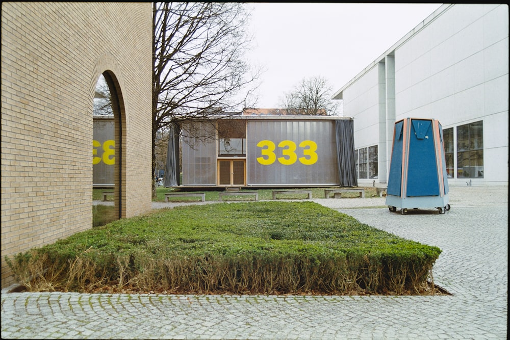 a building that has a lot of grass in front of it