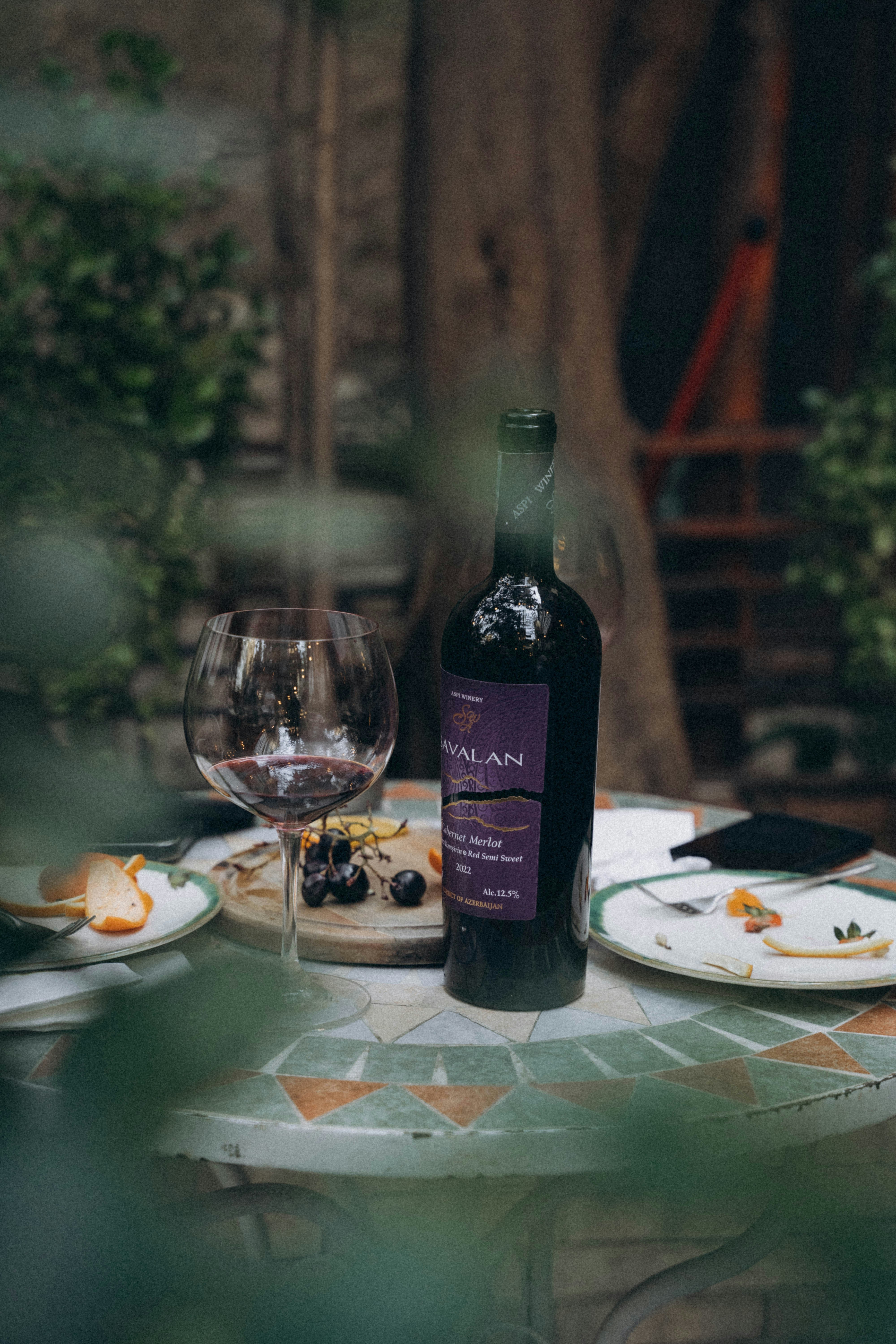 a bottle of wine sitting on top of a table