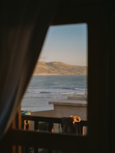 a view of a beach from a window