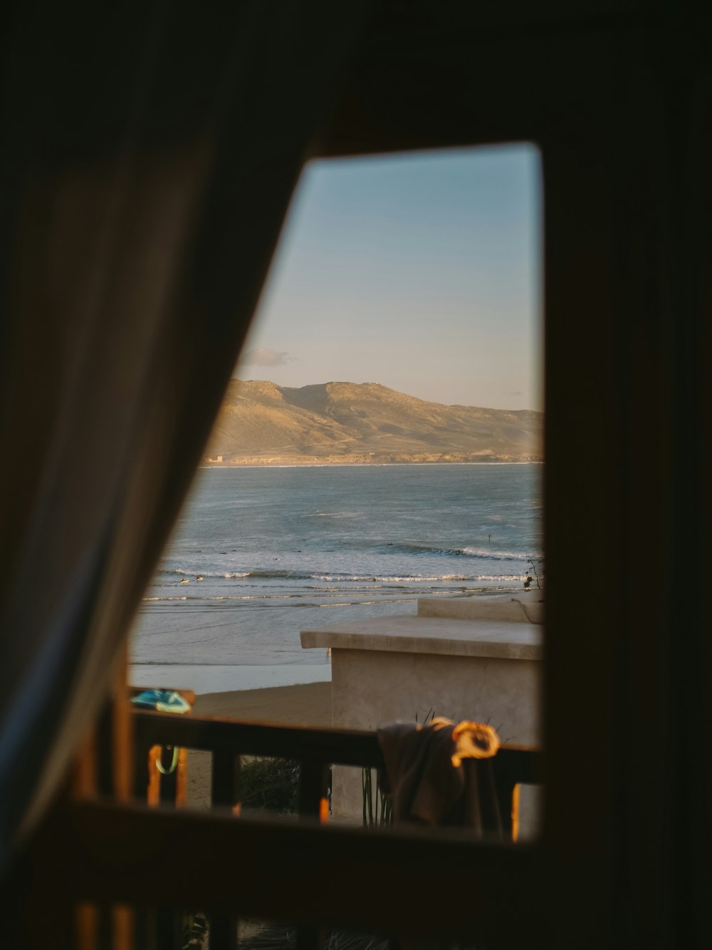 a view of a beach from a window