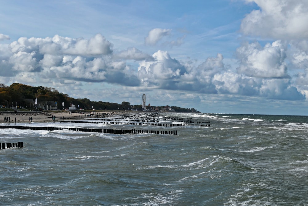 a view of the ocean with a pier in the foreground