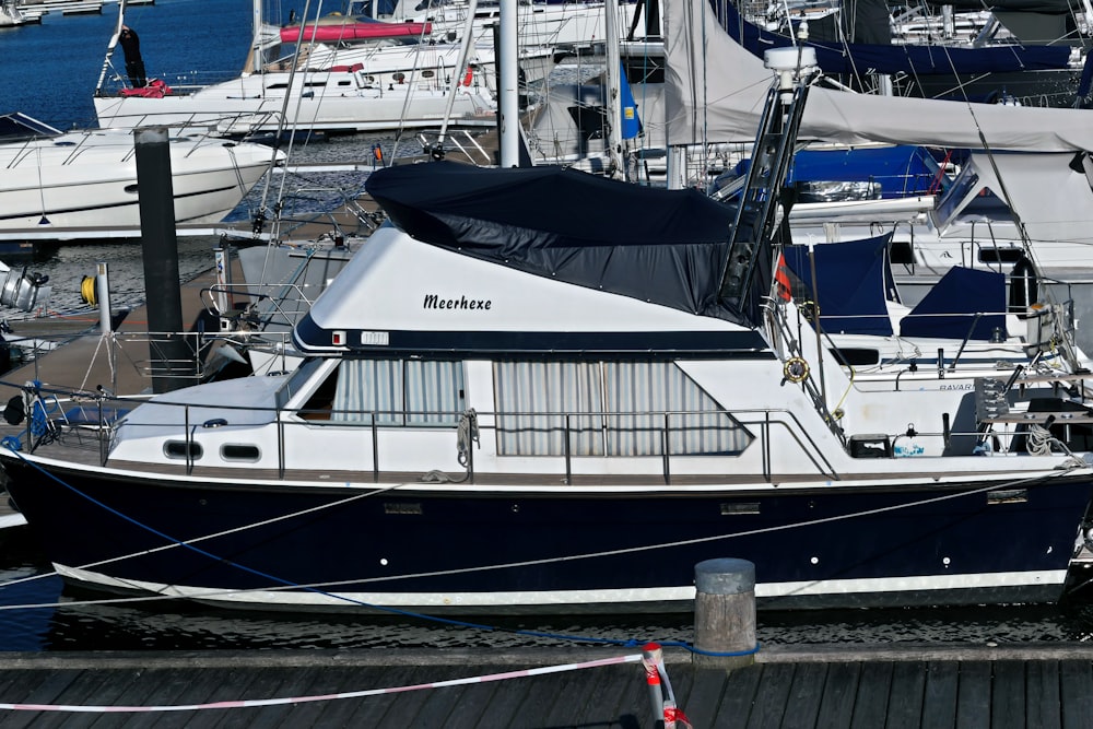 a boat docked at a dock with other boats