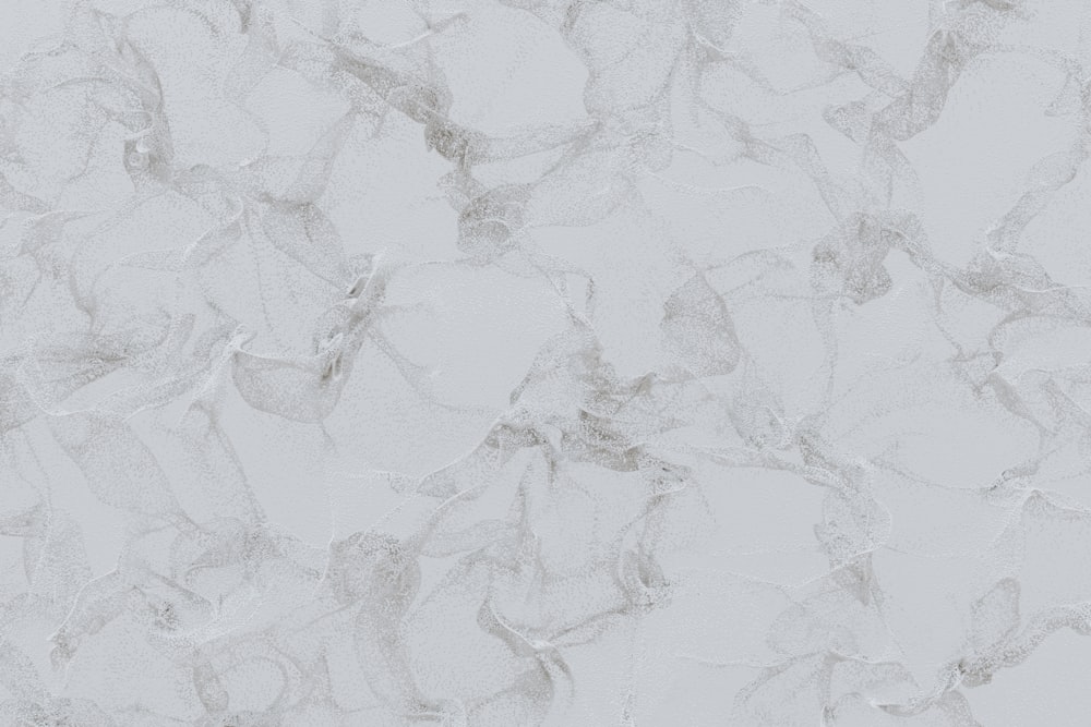 a close up of a white marble wall