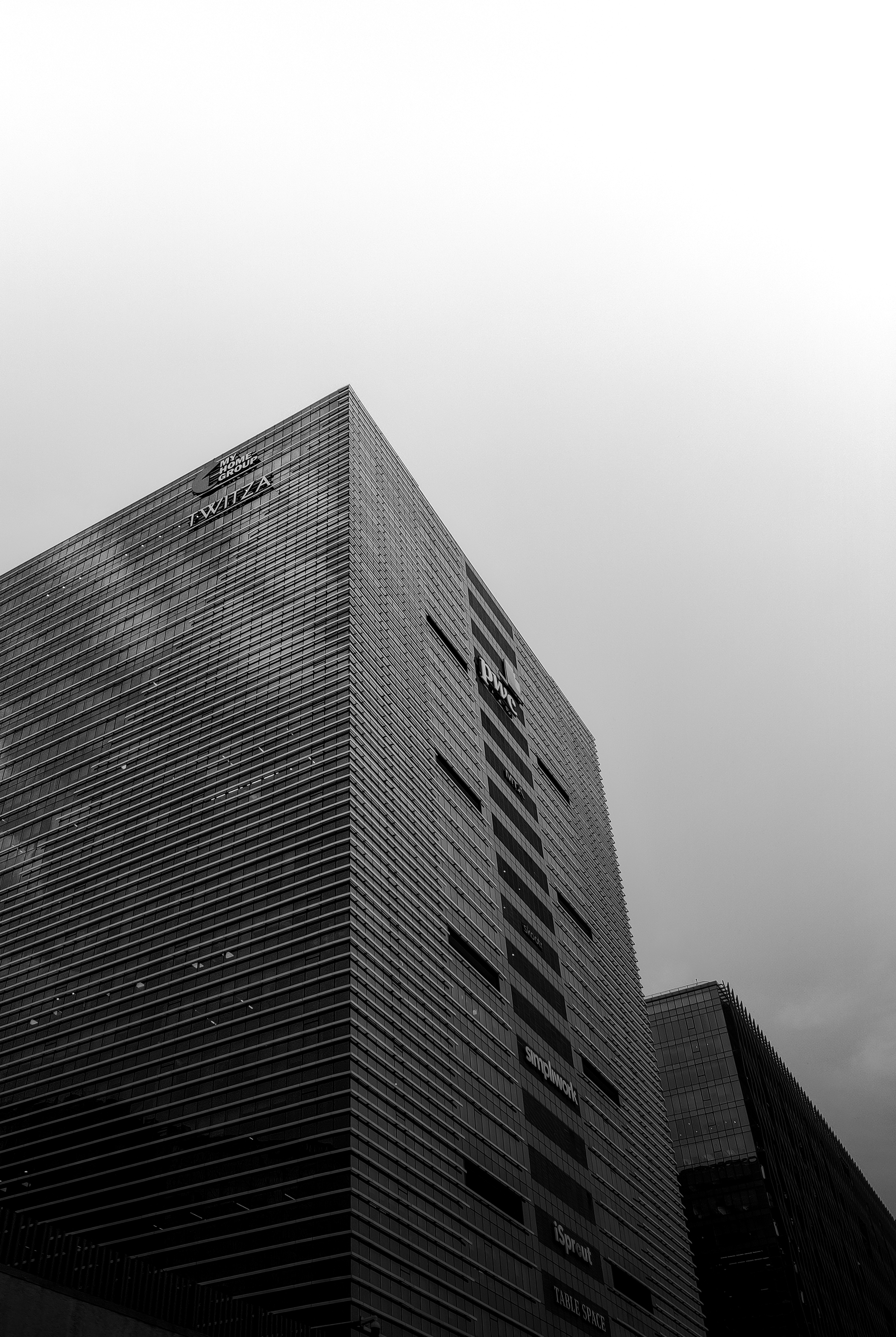 a black and white photo of a tall building