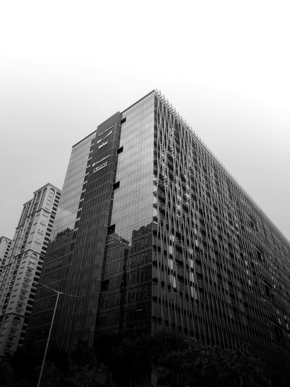 a black and white photo of a very tall building