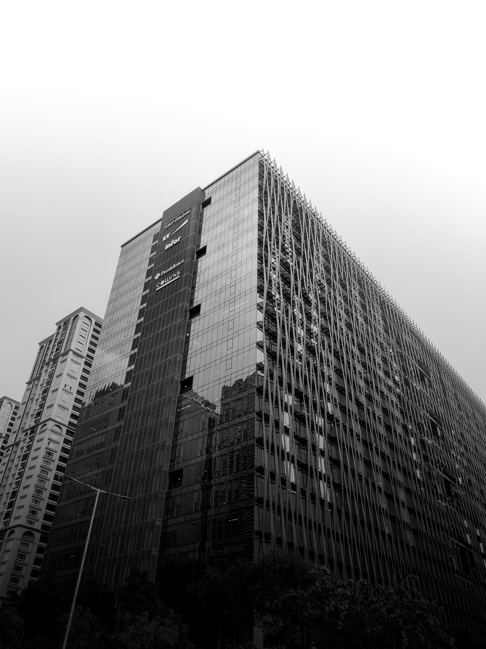 a black and white photo of a very tall building