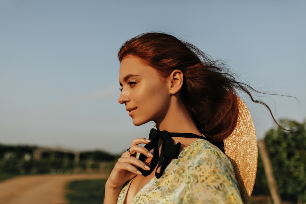 a woman with a black bow around her neck