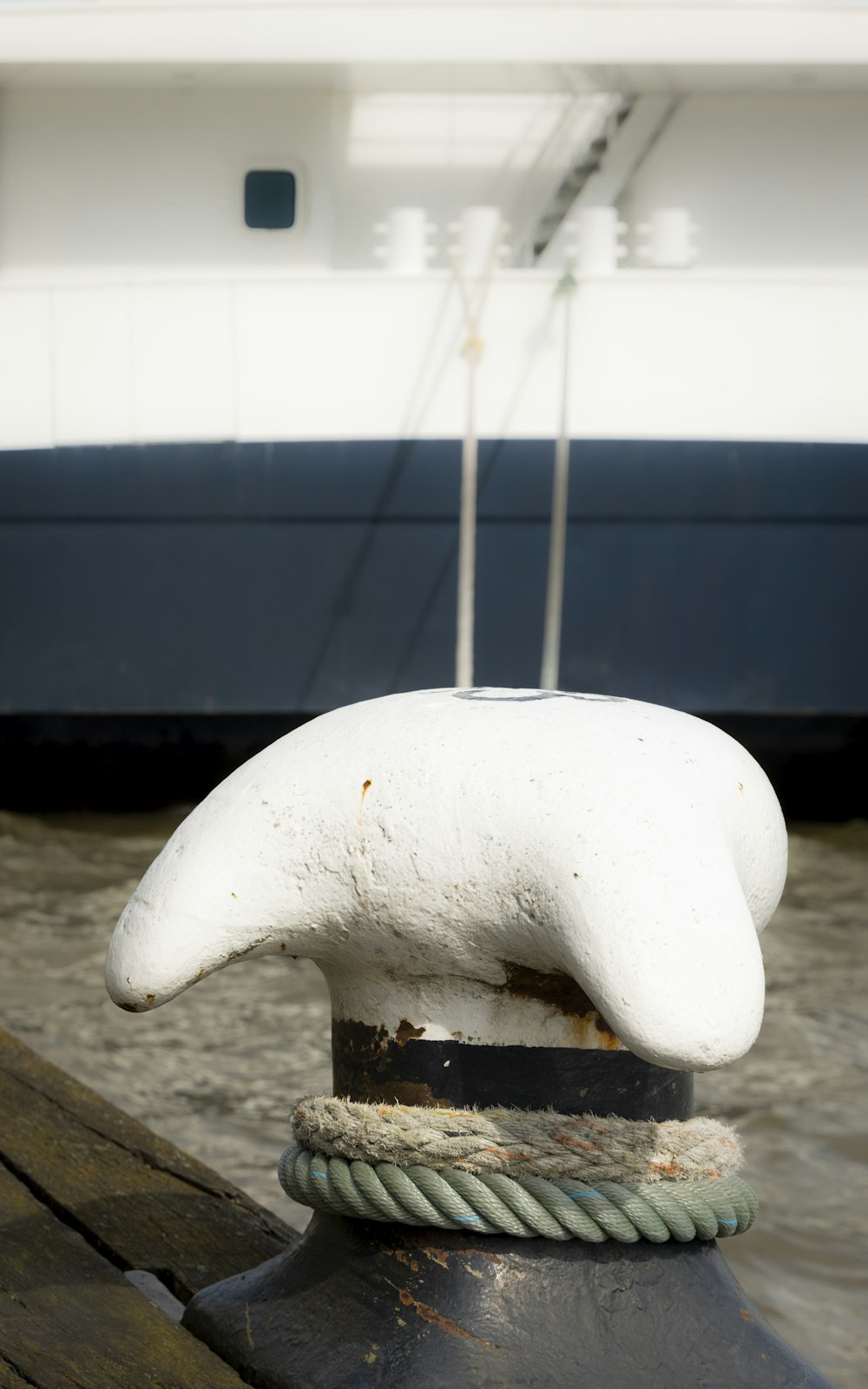 a large white object sitting on top of a wooden dock