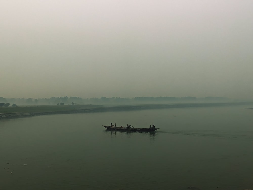 a small boat on a large body of water