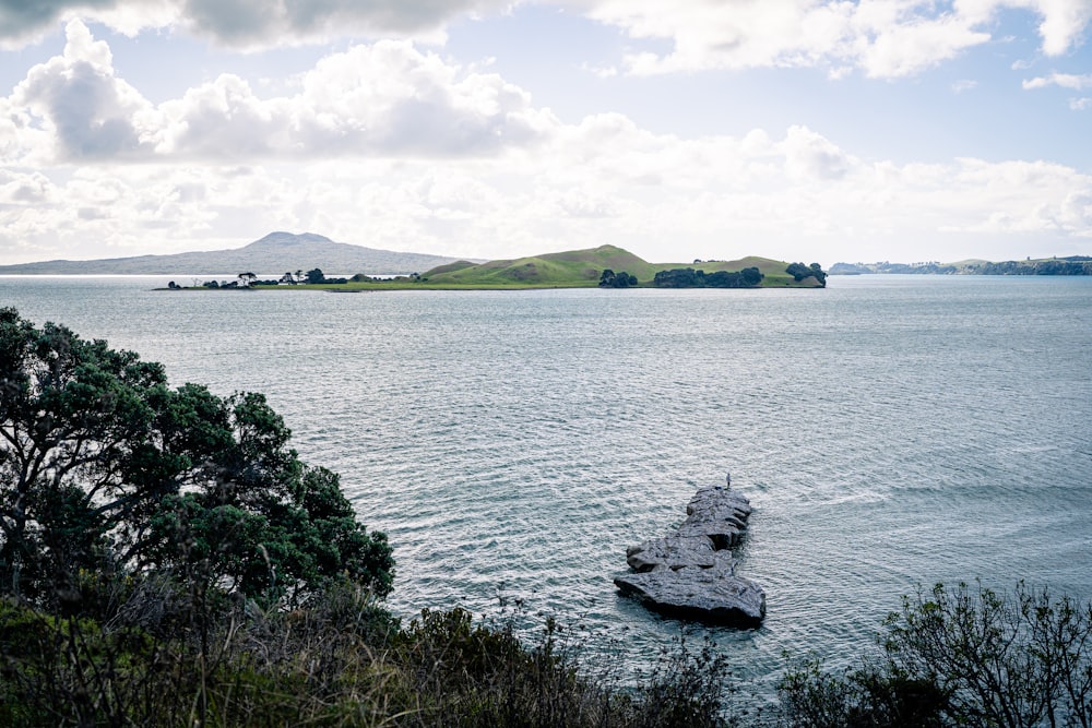 a boat floating on top of a large body of water