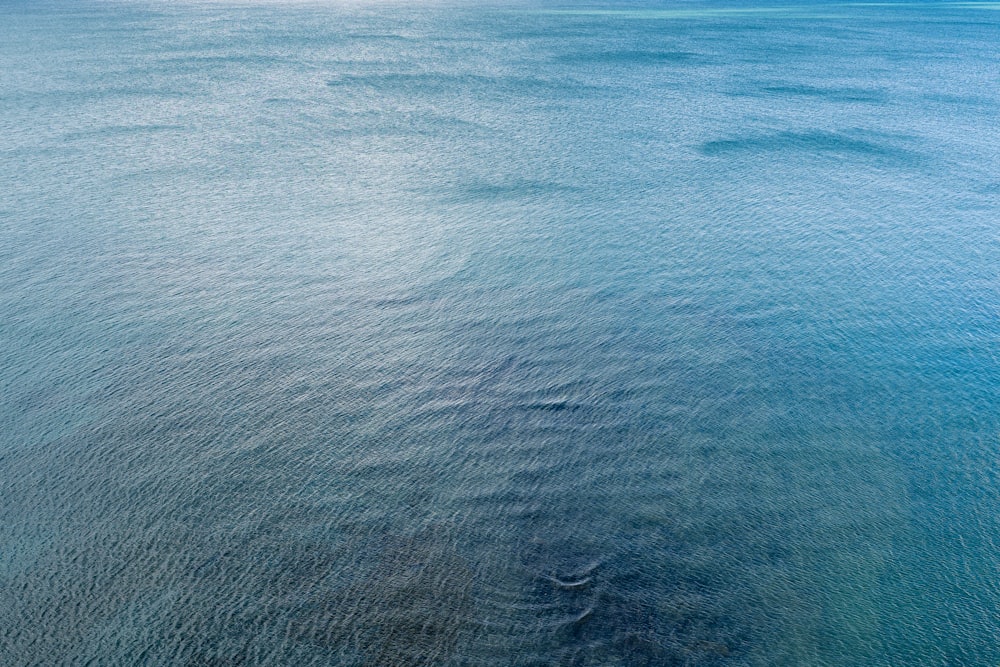 a large body of water with a boat in it