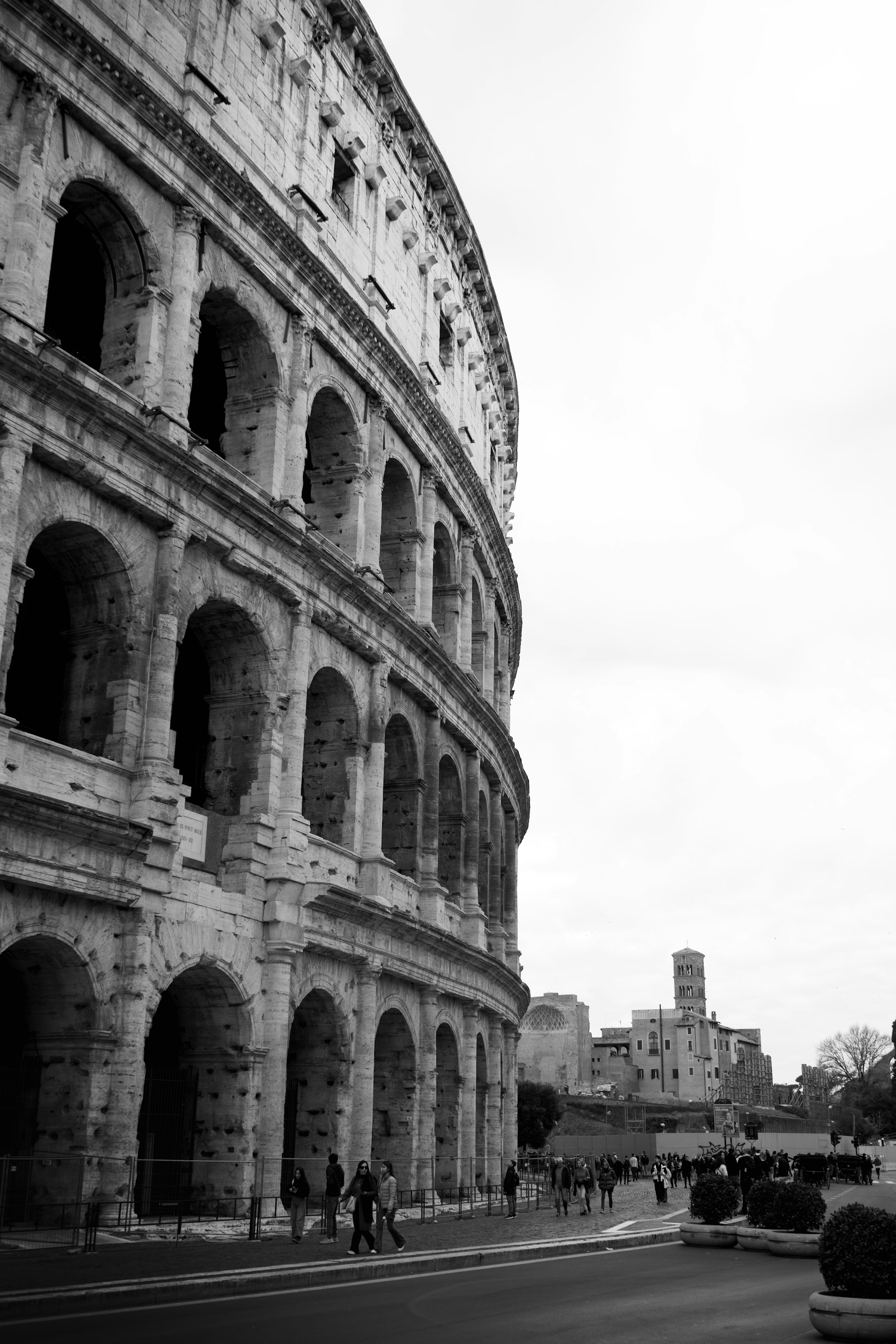a black and white photo of a roman colossion
