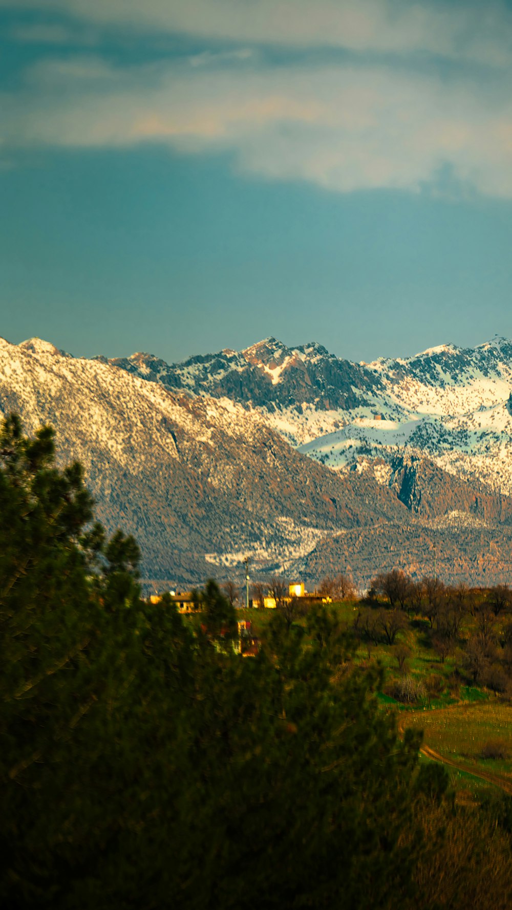 a view of a snowy mountain range from a distance