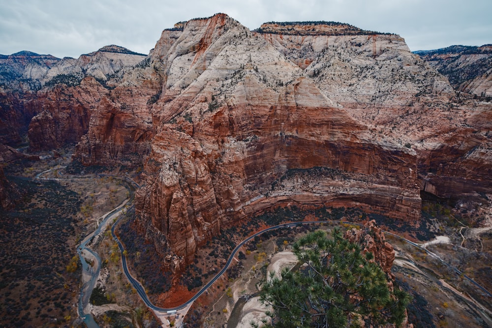 an aerial view of a canyon with a winding road