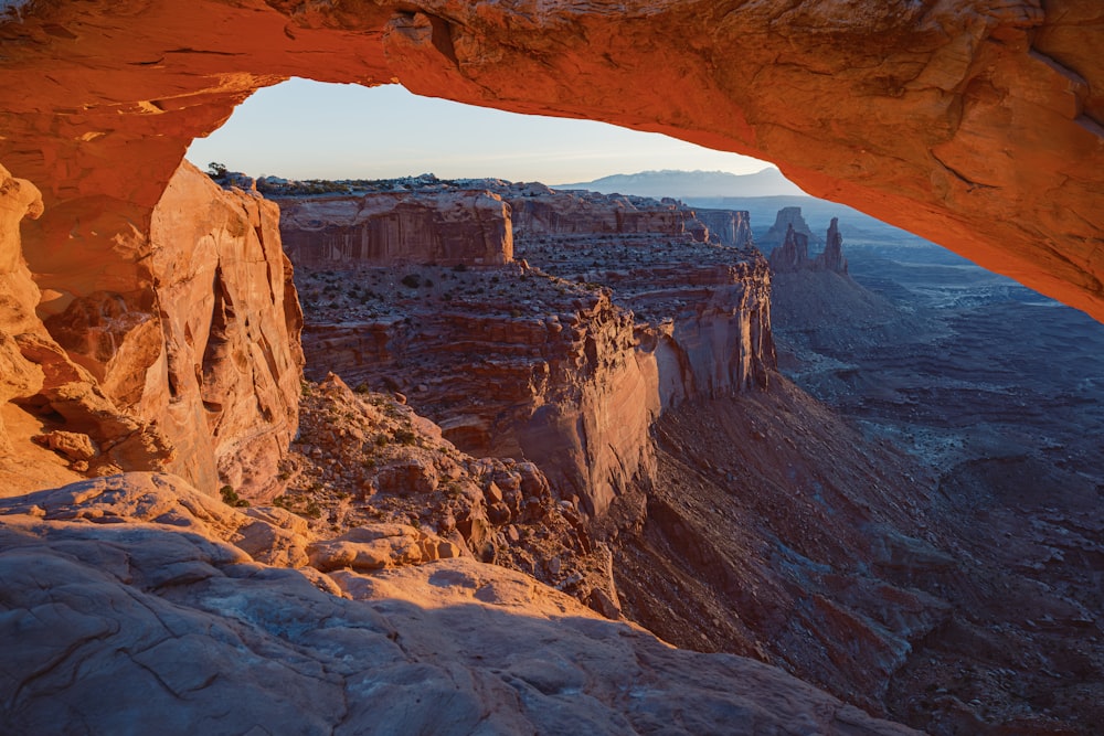 a large rock formation with a small arch in the middle of it