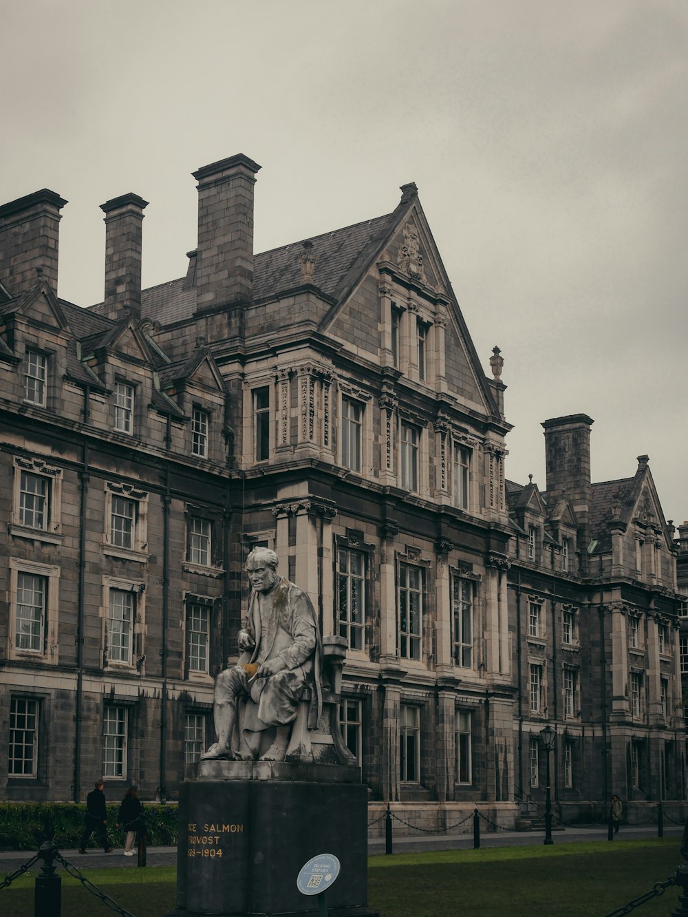 a large building with a statue in front of it