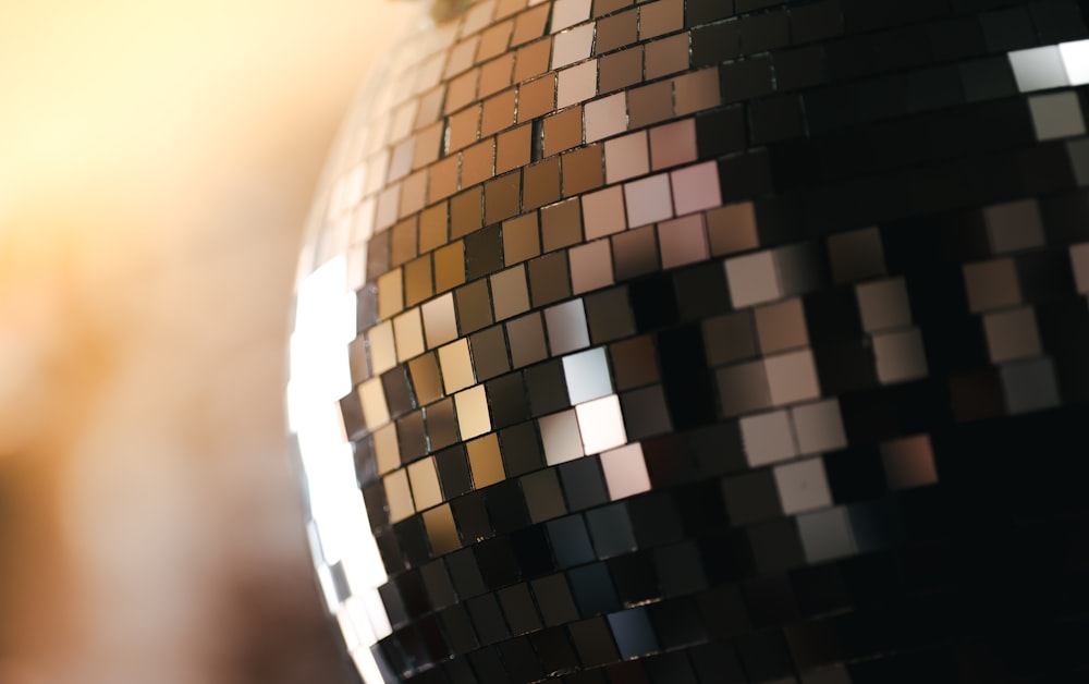 a close up of a disco ball with a blurry background