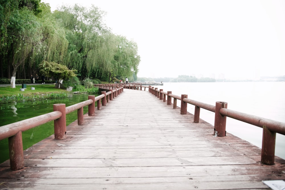 a long wooden bridge over a body of water