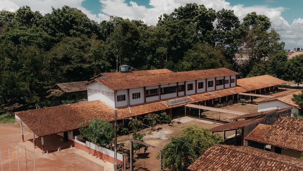 an aerial view of a school building in a rural area