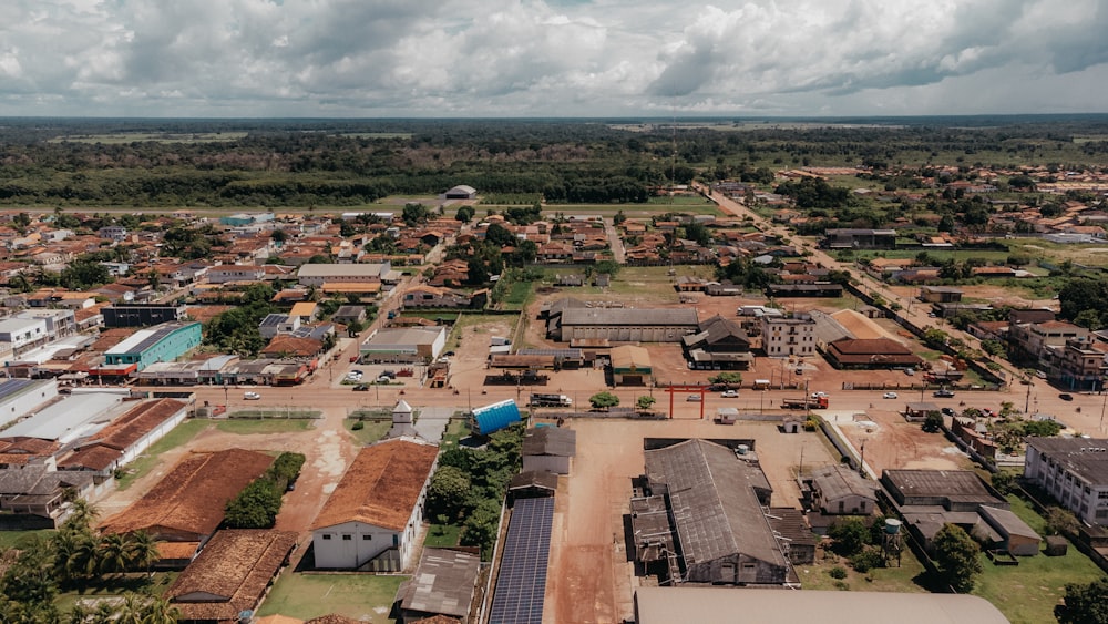 an aerial view of a small town in the middle of a field